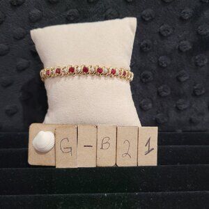 Item # GB21  10K Gold 7 in Tennis Style Bracelet with rubies and tiny diamonds